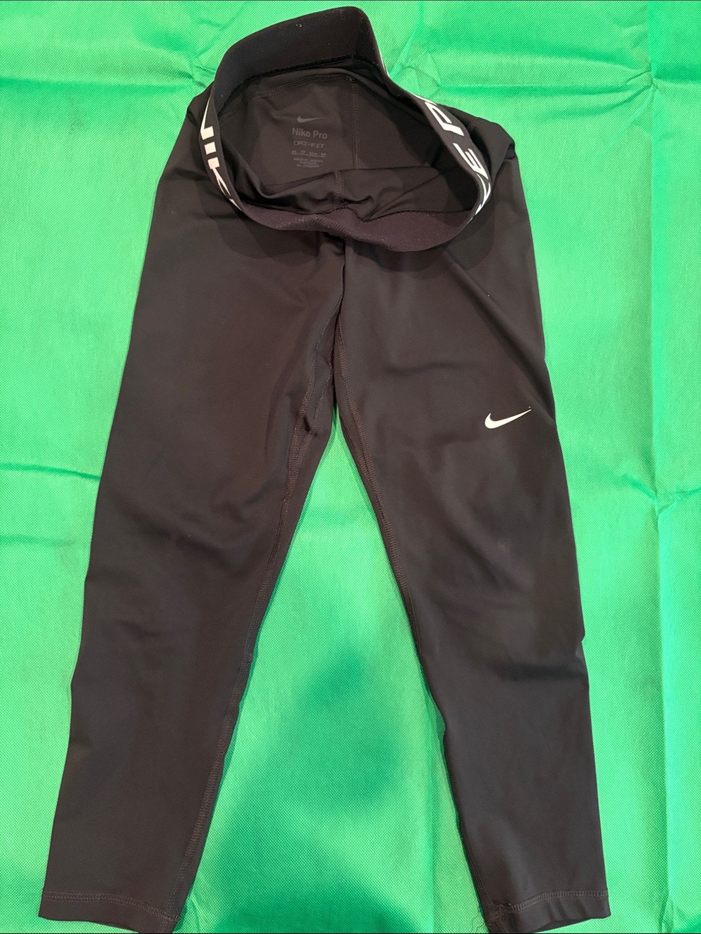 Nike Kids Black Performance Leggings with White Swoosh